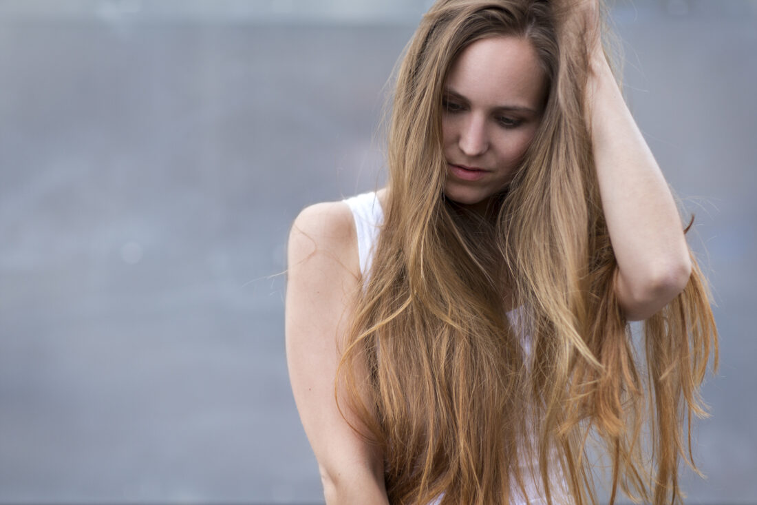 Woman long hair outdoors Tribeca Salons Blog